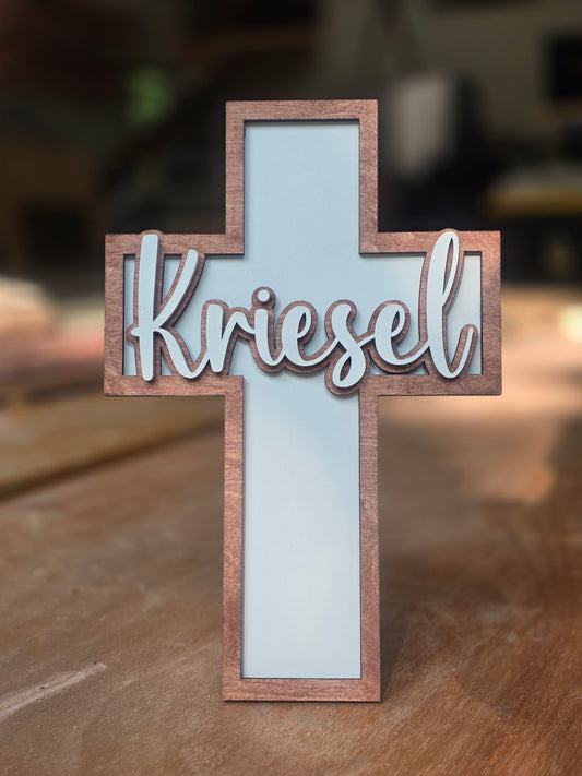 Personalized wood cross sign with a name and blue-painted center, a gift under $100